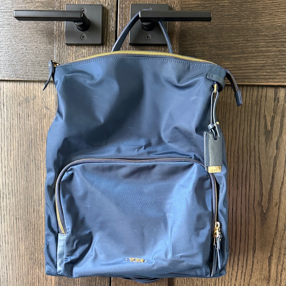 Tumi Navy Backpack with Gold Accents